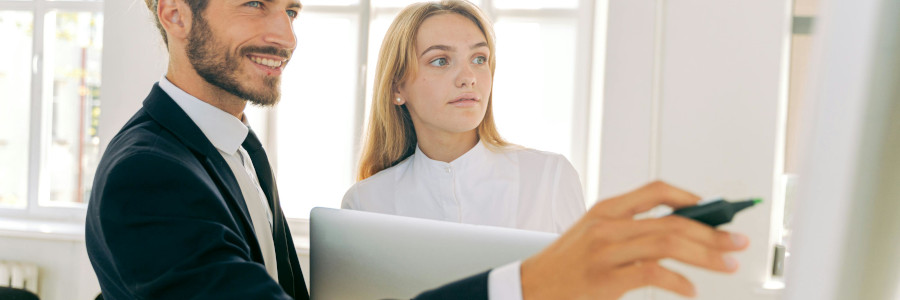 Product Owner and Product Manager in front of a paper board